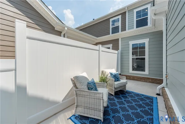 a view of wooden door and chair in wooden floor