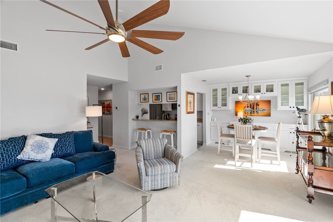 620 South Fulton Beach Road, Unit 611 Rockport, TX 78382 - Photo 6 of 15 a living room with furniture kitchen view and a wooden floor