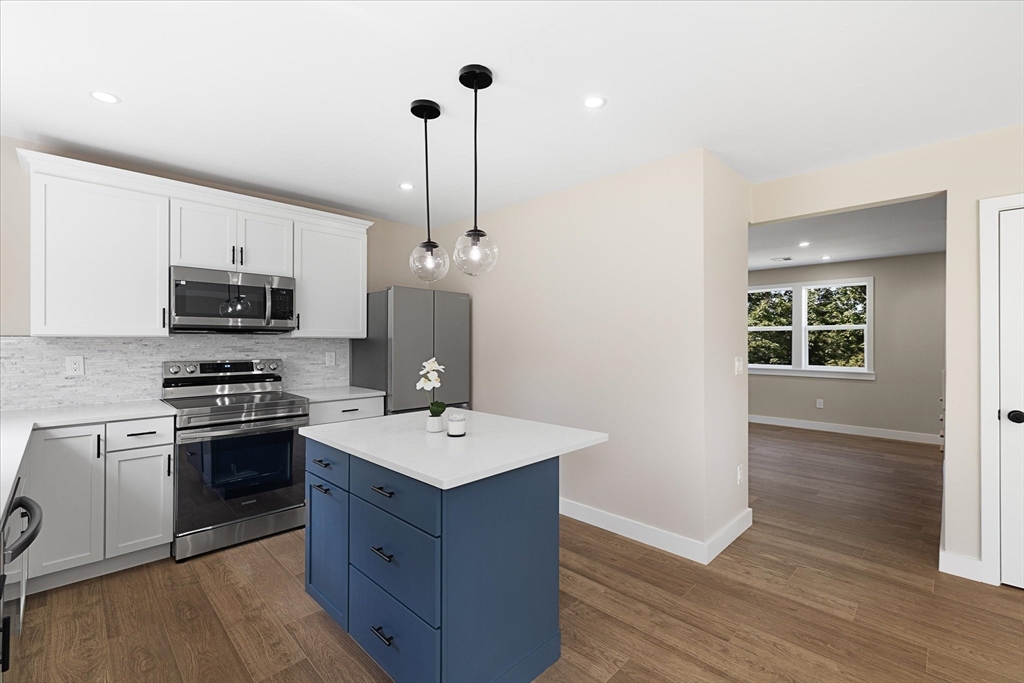 6 Eagleton Street Spencer, MA 01562 - Photo 13 of 36 a kitchen with a sink appliances and wooden floor