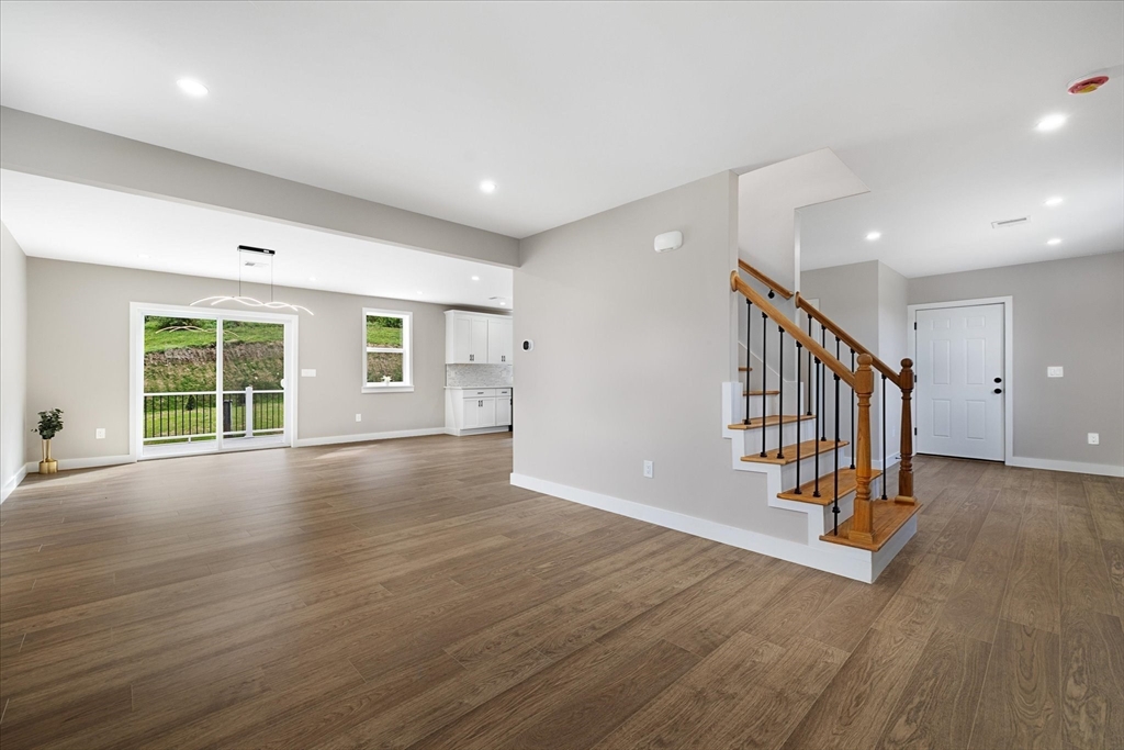 6 Eagleton Street Spencer, MA 01562 - Photo 5 of 36 a view of an empty room with wooden floor and windows
