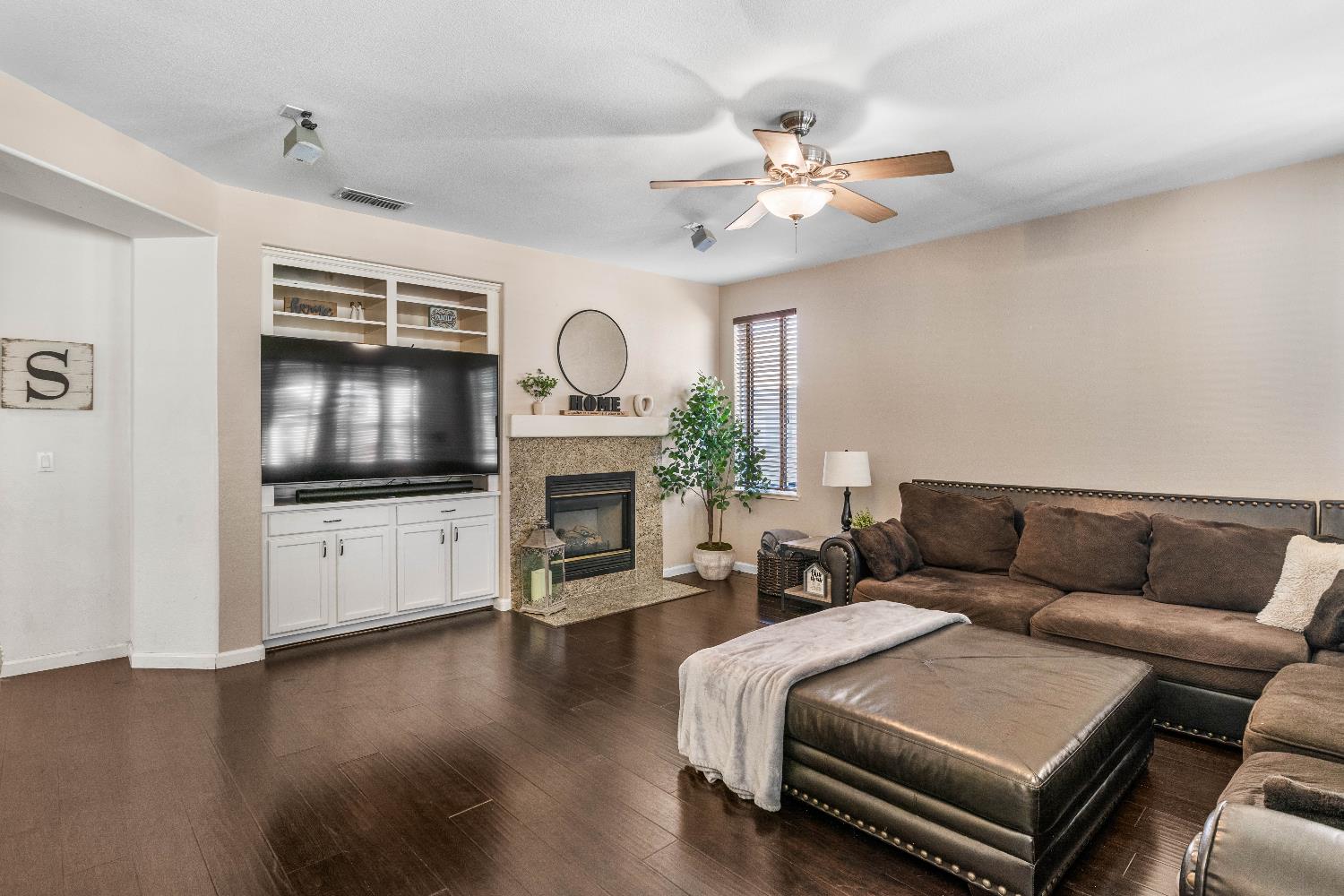 1777 Daniel Drive Ripon, CA 95366 - Photo 14 of 44 a living room with furniture and a flat screen tv