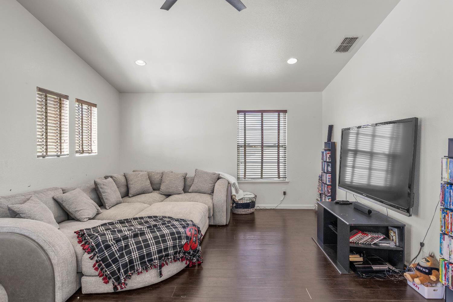 1777 Daniel Drive Ripon, CA 95366 - Photo 21 of 44 a living room with furniture a flat screen tv and a window