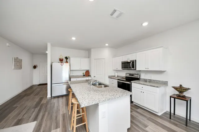 a living room with fireplace furniture and a flat screen tv