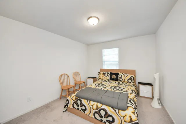 a bathroom with a toilet a sink and a large mirror