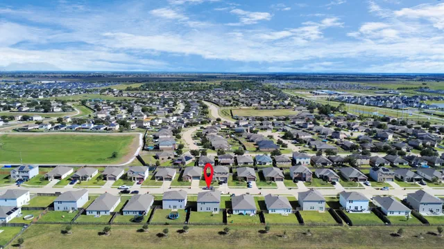 an aerial view of a house with a yard pool fire pit and outdoor seating