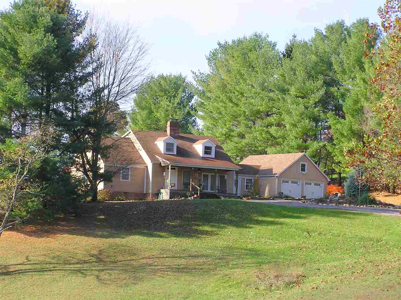 62 Jonestown Road Fairfield, VA 24435 - Photo 1 of 42 a front view of a house with a yard table and chairs