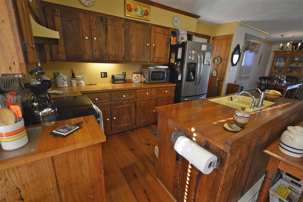 62 Jonestown Road Fairfield, VA 24435 - Photo 18 of 42 a kitchen with a refrigerator and a stove top oven
