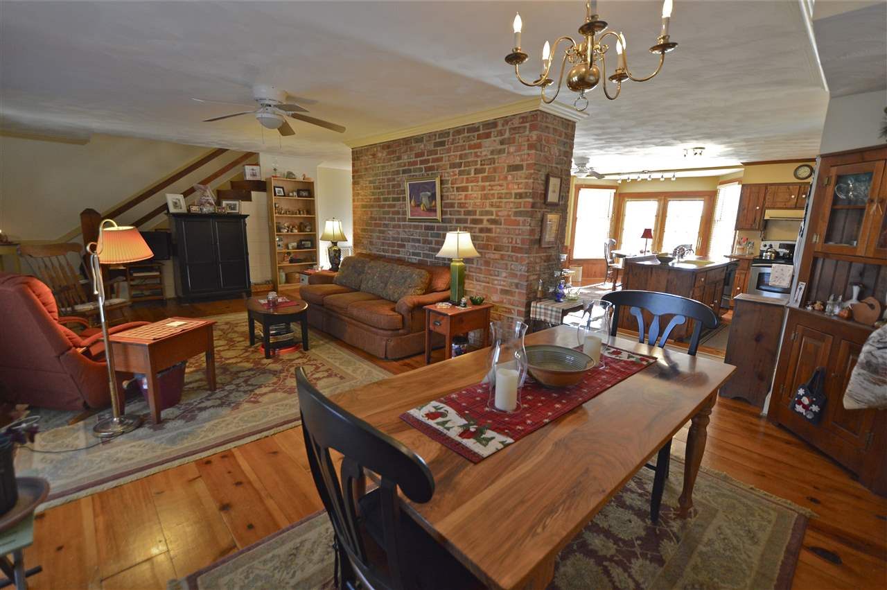 62 Jonestown Road Fairfield, VA 24435 - Photo 10 of 42 a living room with furniture a fireplace and a chandelier
