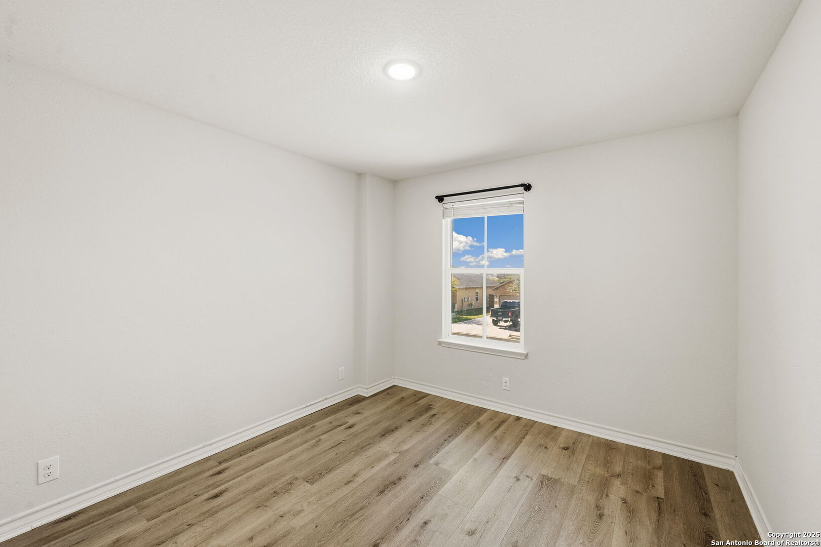 328 Swift Move Cibolo, TX 78108 - Photo 13 of 32 an empty room with wooden floor and windows