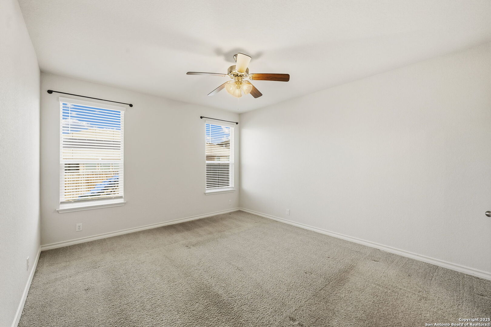 328 Swift Move Cibolo, TX 78108 - Photo 15 of 32 an empty room with windows and fan