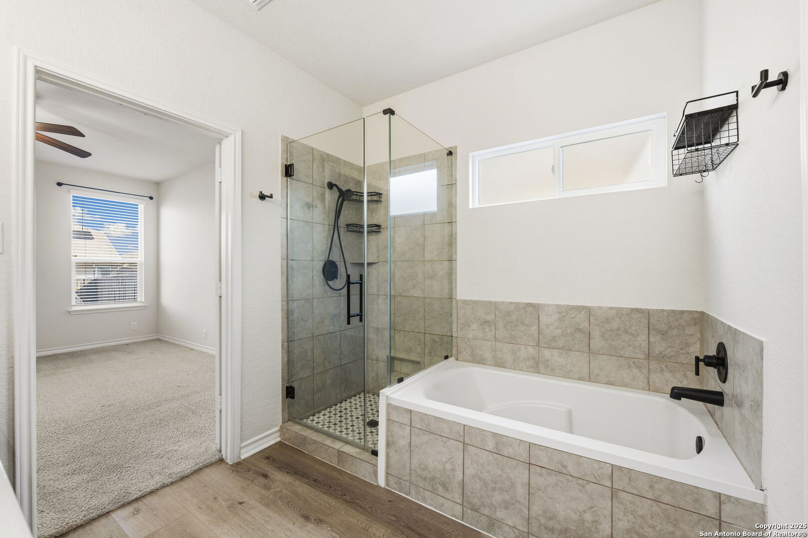 328 Swift Move Cibolo, TX 78108 - Photo 17 of 32 a bathroom with a bathtub a shower and a sink