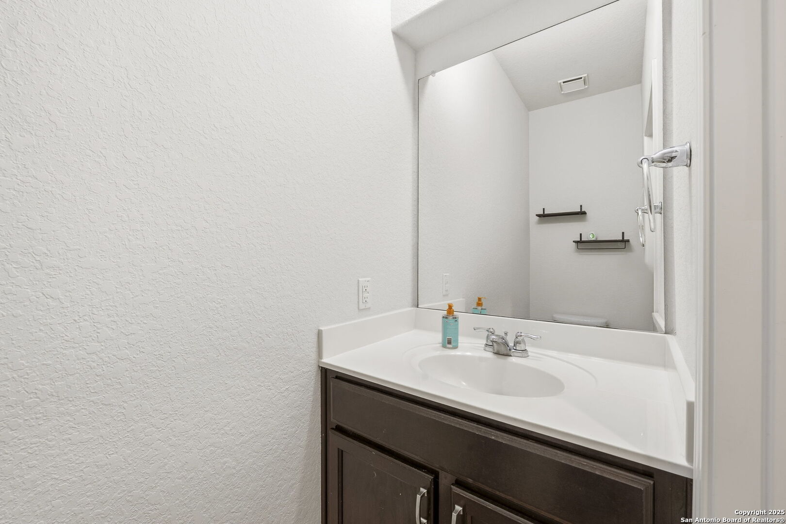 328 Swift Move Cibolo, TX 78108 - Photo 20 of 32 a bathroom with a sink and a mirror