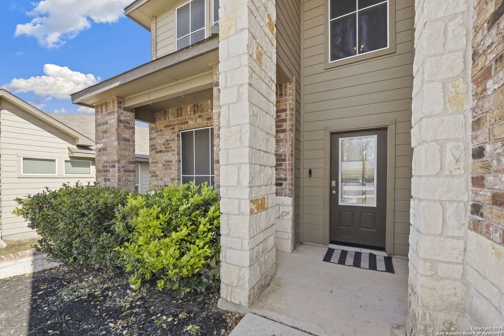328 Swift Move Cibolo, TX 78108 - Photo 2 of 32 a front view of a house with a glass door