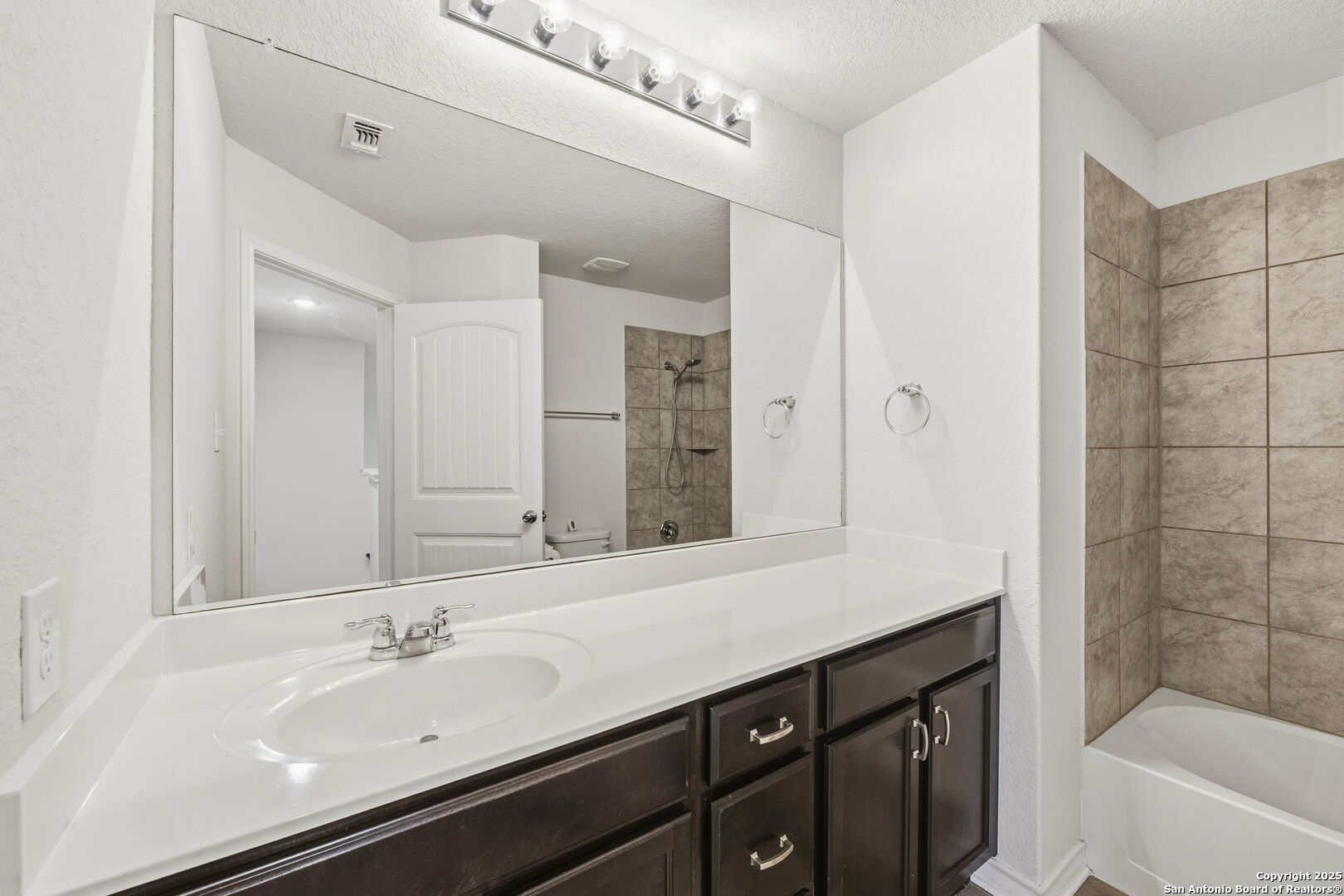 328 Swift Move Cibolo, TX 78108 - Photo 22 of 32 a bathroom with a sink and a mirror