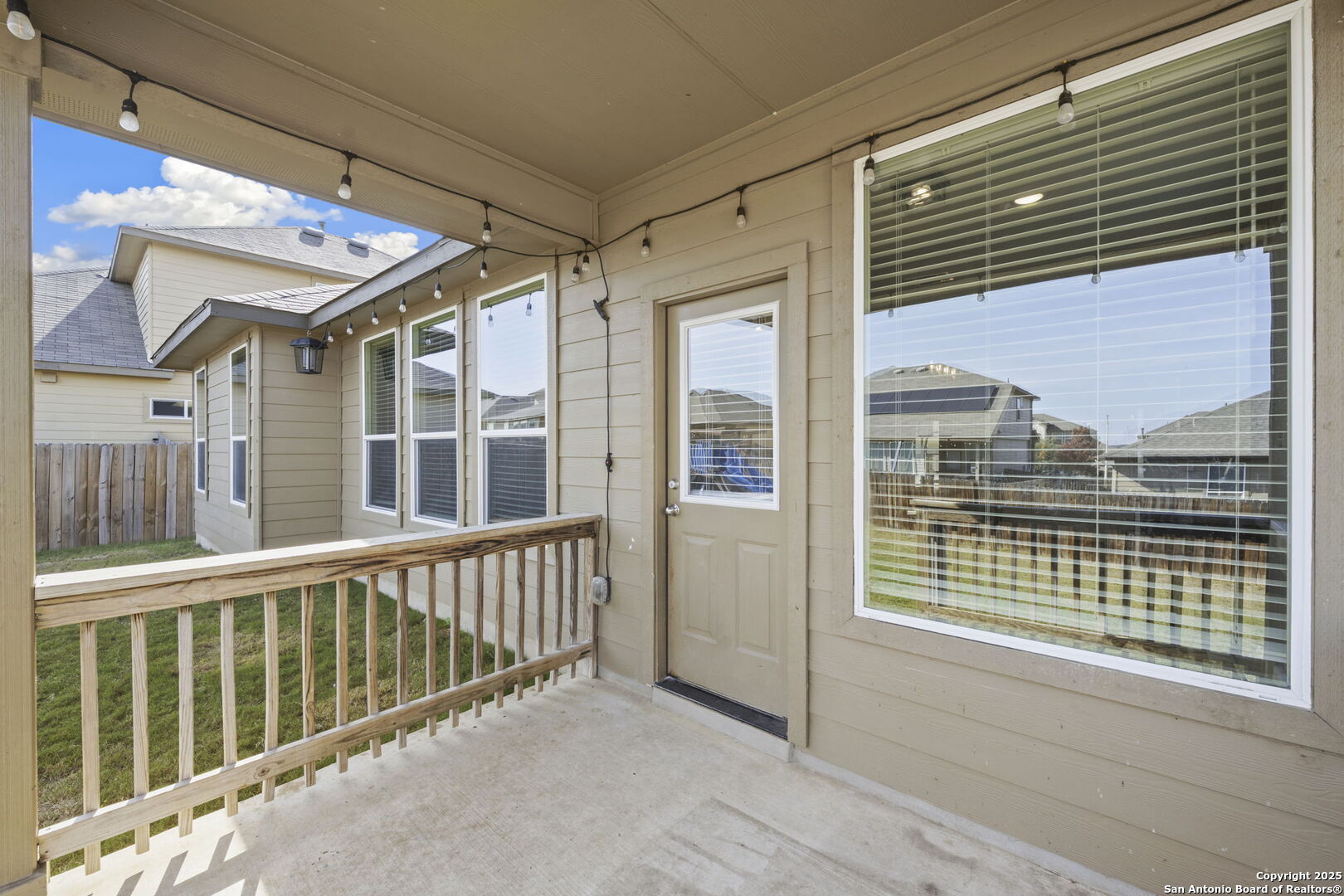 328 Swift Move Cibolo, TX 78108 - Photo 26 of 32 a view of balcony with a large window and wooden floor