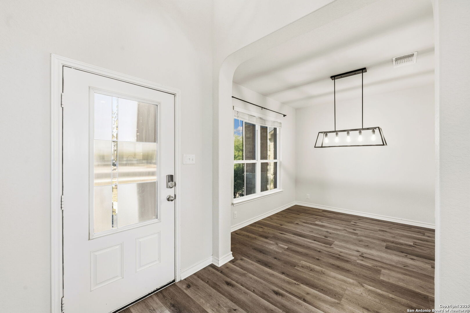328 Swift Move Cibolo, TX 78108 - Photo 3 of 32 a view of a hallway with wooden floor and staircase