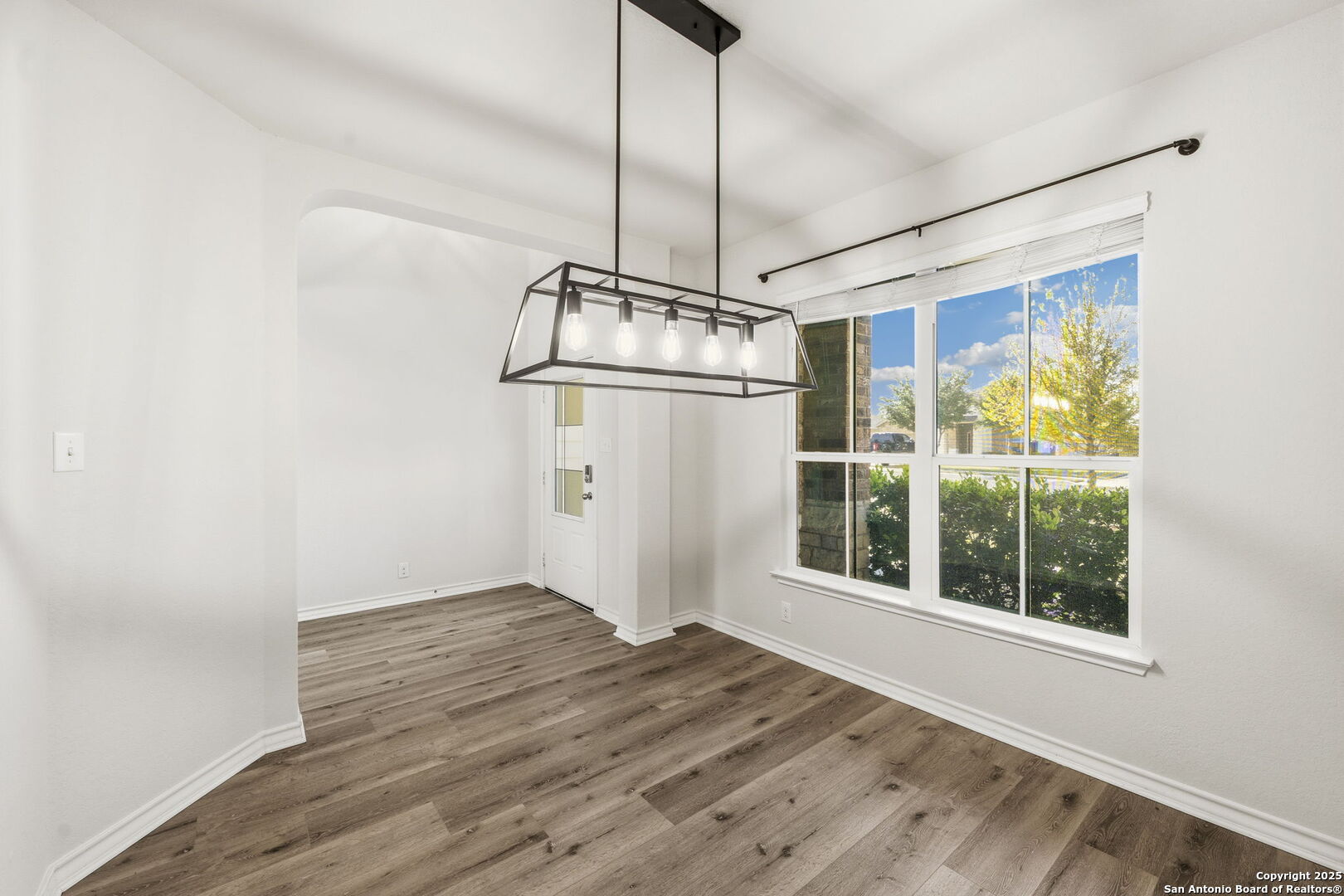328 Swift Move Cibolo, TX 78108 - Photo 4 of 32 a view of empty room with wooden floor and fan