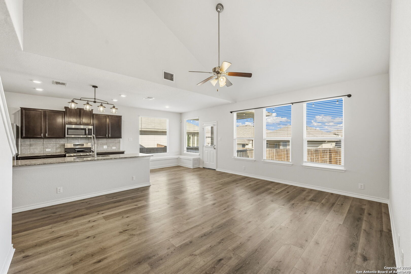 328 Swift Move Cibolo, TX 78108 - Photo 5 of 32 a view of an empty room with kitchen and window