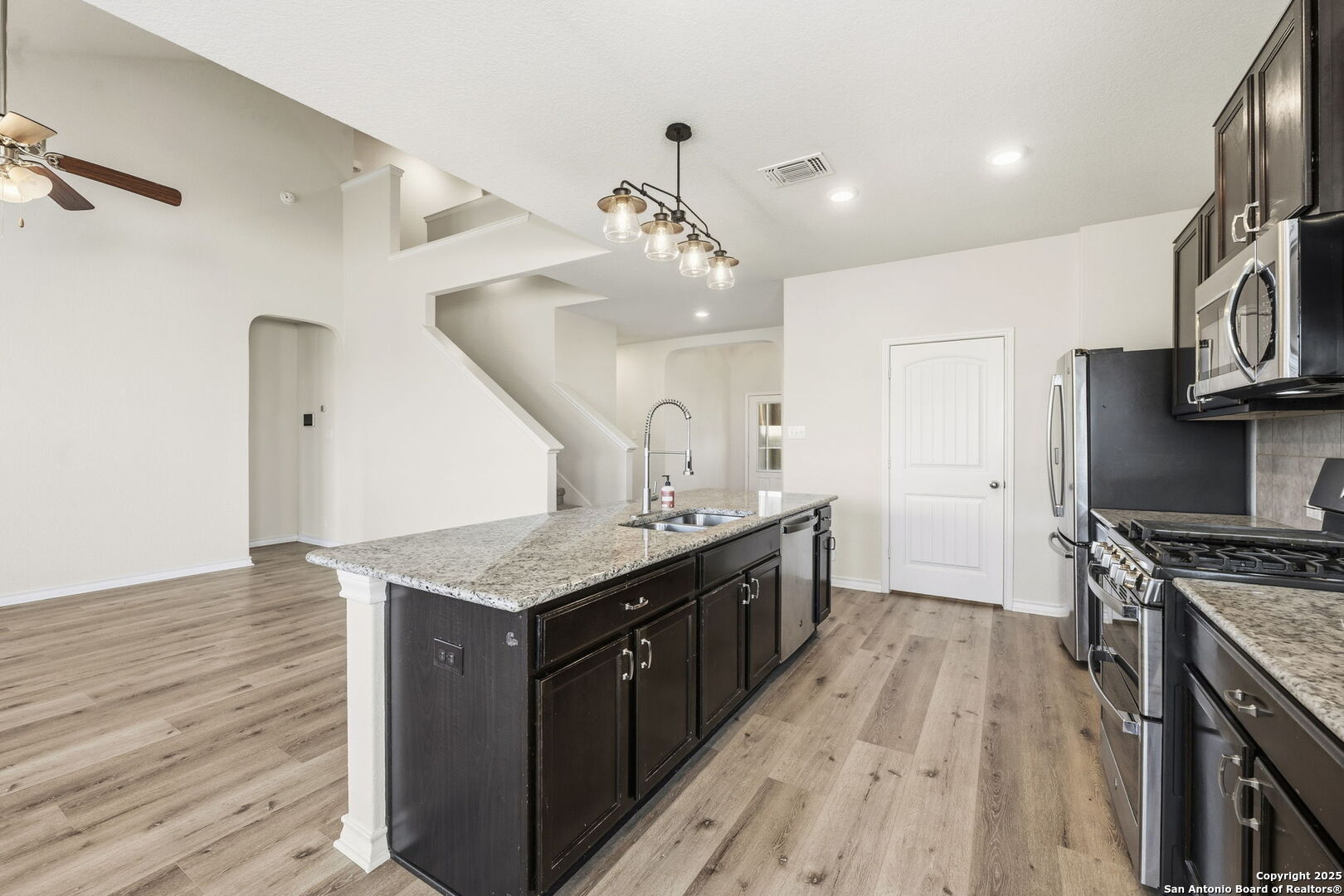 328 Swift Move Cibolo, TX 78108 - Photo 9 of 32 a kitchen with stainless steel appliances granite countertop a stove and a sink