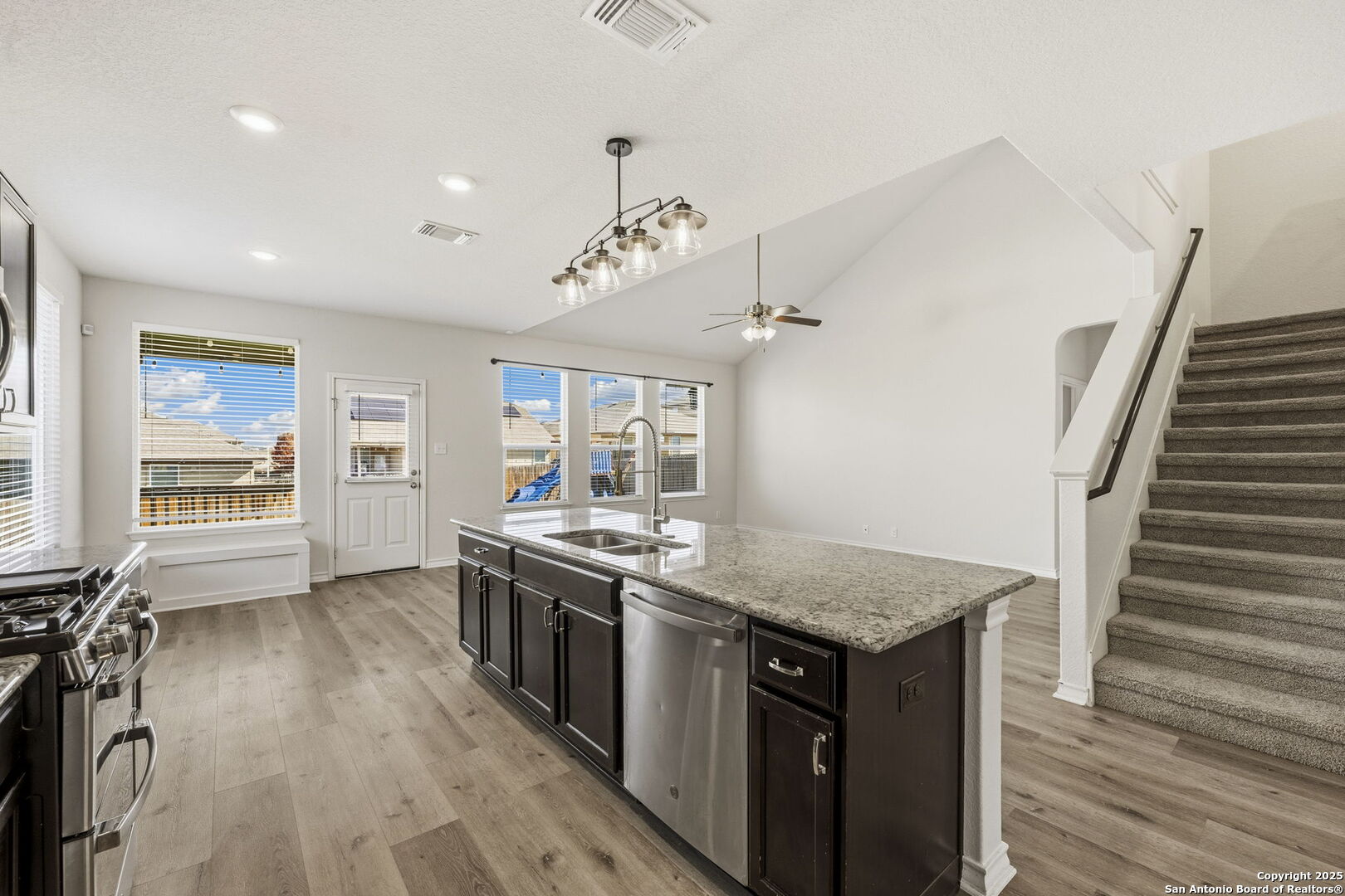 328 Swift Move Cibolo, TX 78108 - Photo 10 of 32 a kitchen with a stove a sink and wooden floor