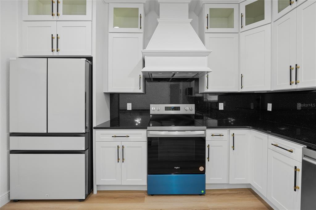 9789 Southwest 125th Ct Road Dunnellon, FL 34432 - Photo 12 of 37 a kitchen with cabinets and appliances