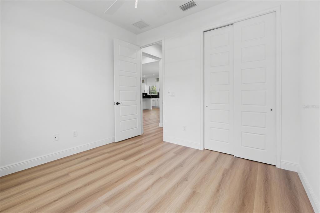 9789 Southwest 125th Ct Road Dunnellon, FL 34432 - Photo 15 of 37 wooden floor in an empty room