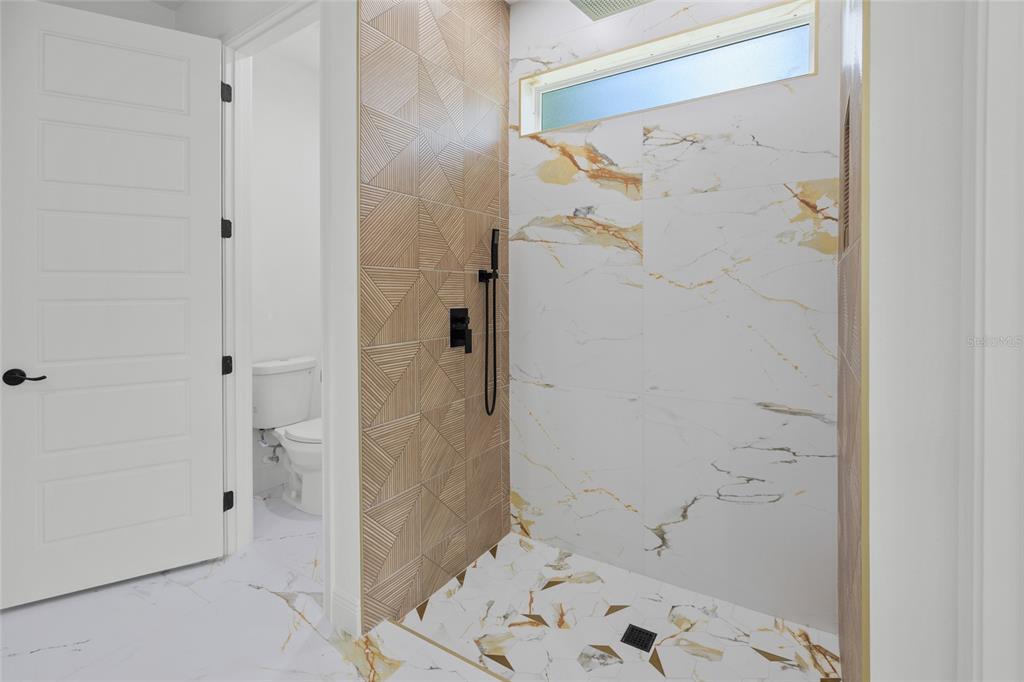 9789 Southwest 125th Ct Road Dunnellon, FL 34432 - Photo 26 of 37 a bathroom with a bathtub and shower