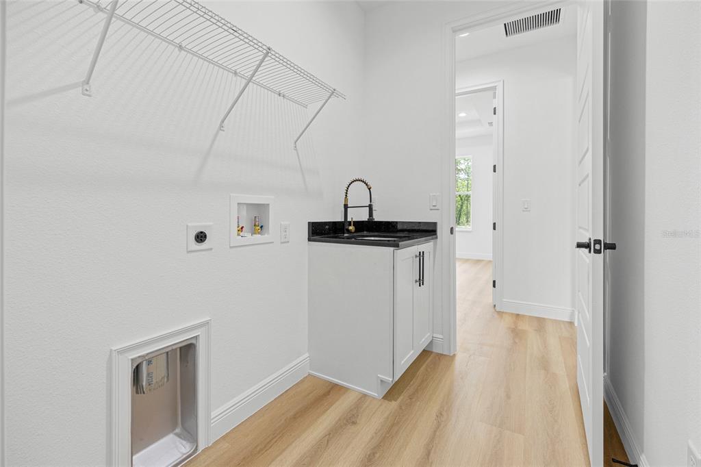 9789 Southwest 125th Ct Road Dunnellon, FL 34432 - Photo 27 of 37 a view of a hardwood floor with a sink