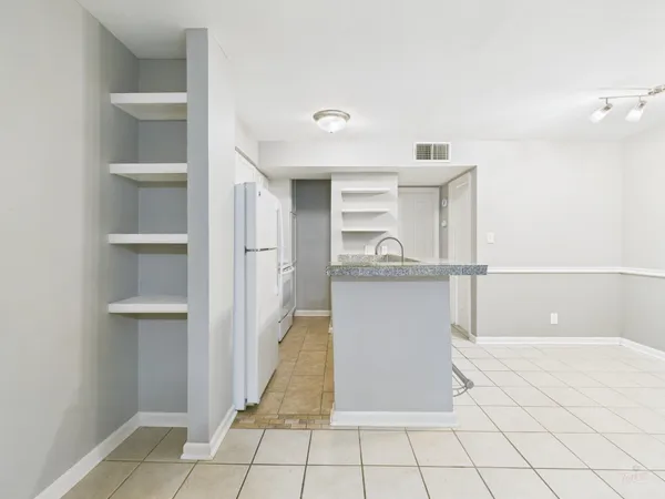 a kitchen with stainless steel appliances granite countertop a sink and a stove