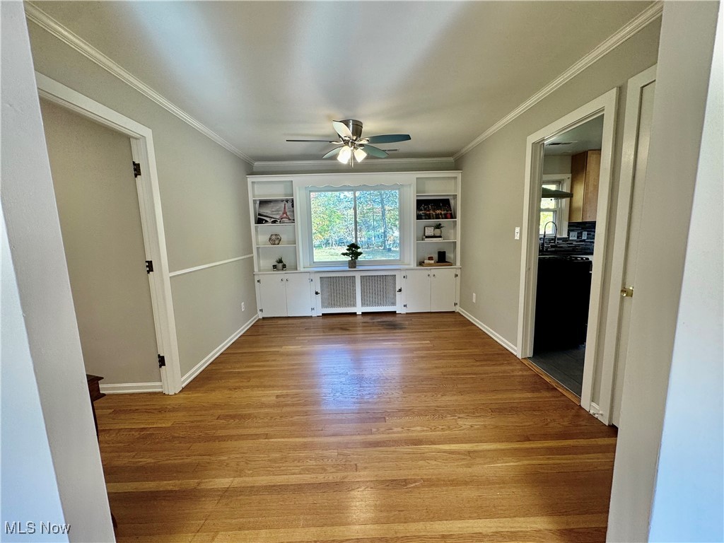 1729 East Pleasant Valley Road Independence, OH 44131 - Photo 12 of 41 Dining room w light hardwood / wood-style flooring, ornamental molding, radiator, and ceiling fan