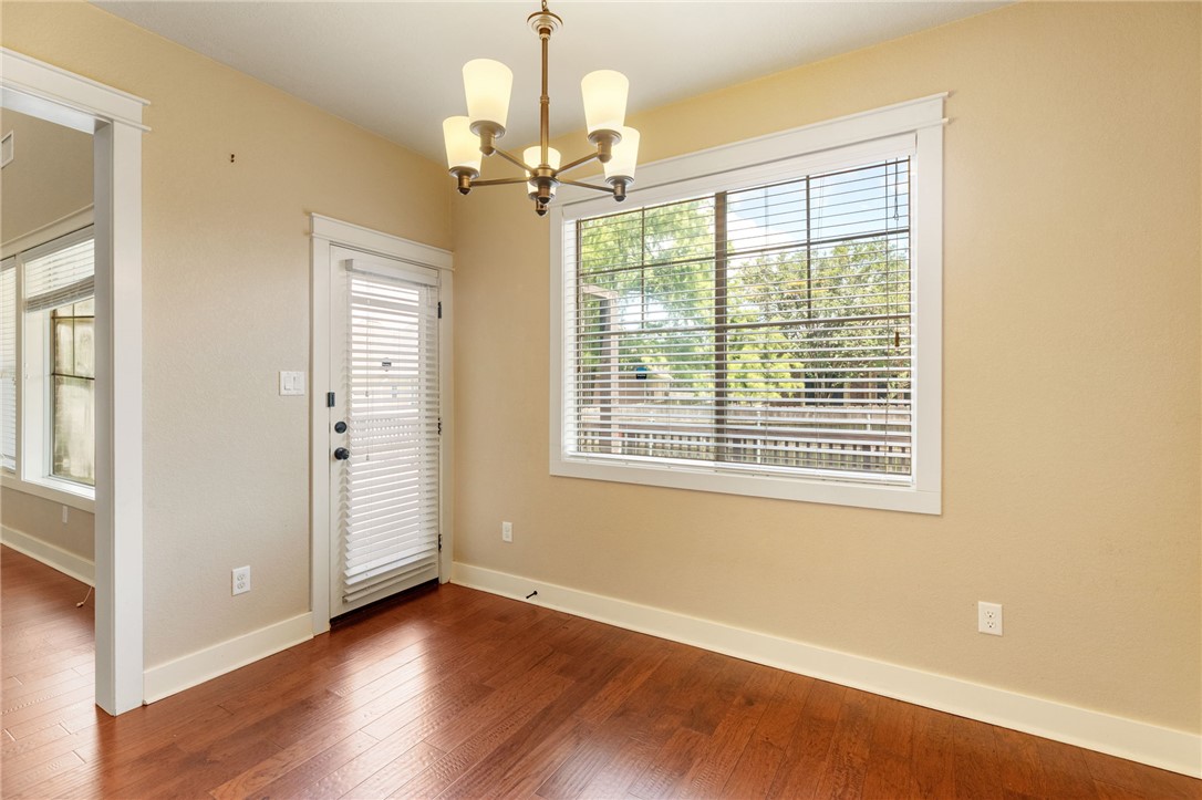2136 Rockcliffe Loop College Station, TX 77845 - Photo 22 of 48 a view of an empty room with wooden floor and a window