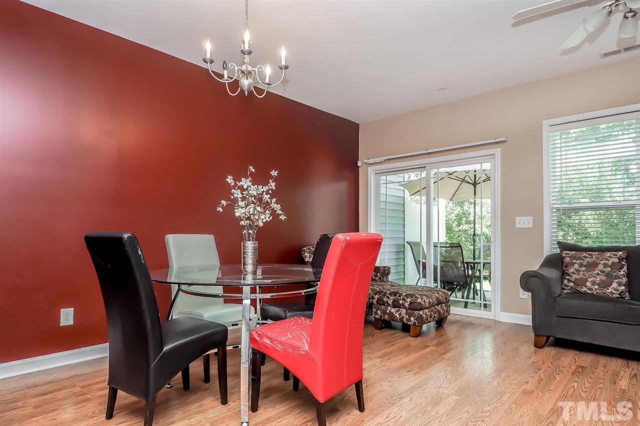 2112 Stoney Spring Drive Raleigh, NC 27610 - Photo 12 of 25 a view of a dining room with furniture and chandelier