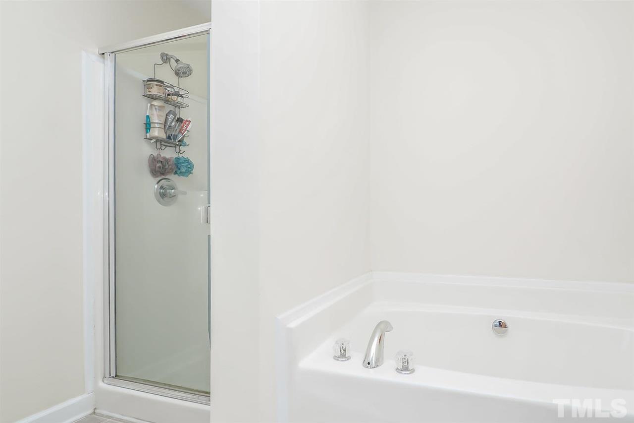 2112 Stoney Spring Drive Raleigh, NC 27610 - Photo 18 of 25 a bathroom with a bathtub