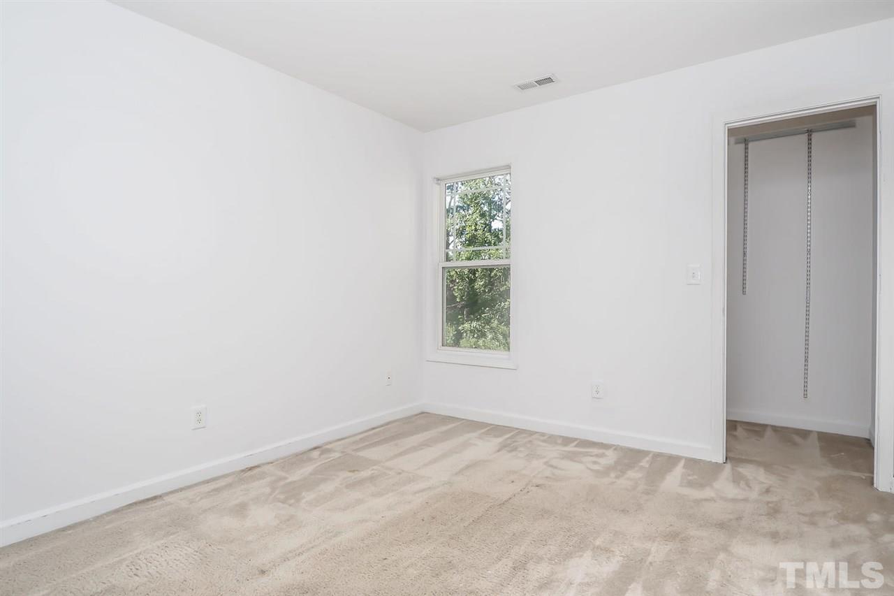 2112 Stoney Spring Drive Raleigh, NC 27610 - Photo 20 of 25 an empty room with a window