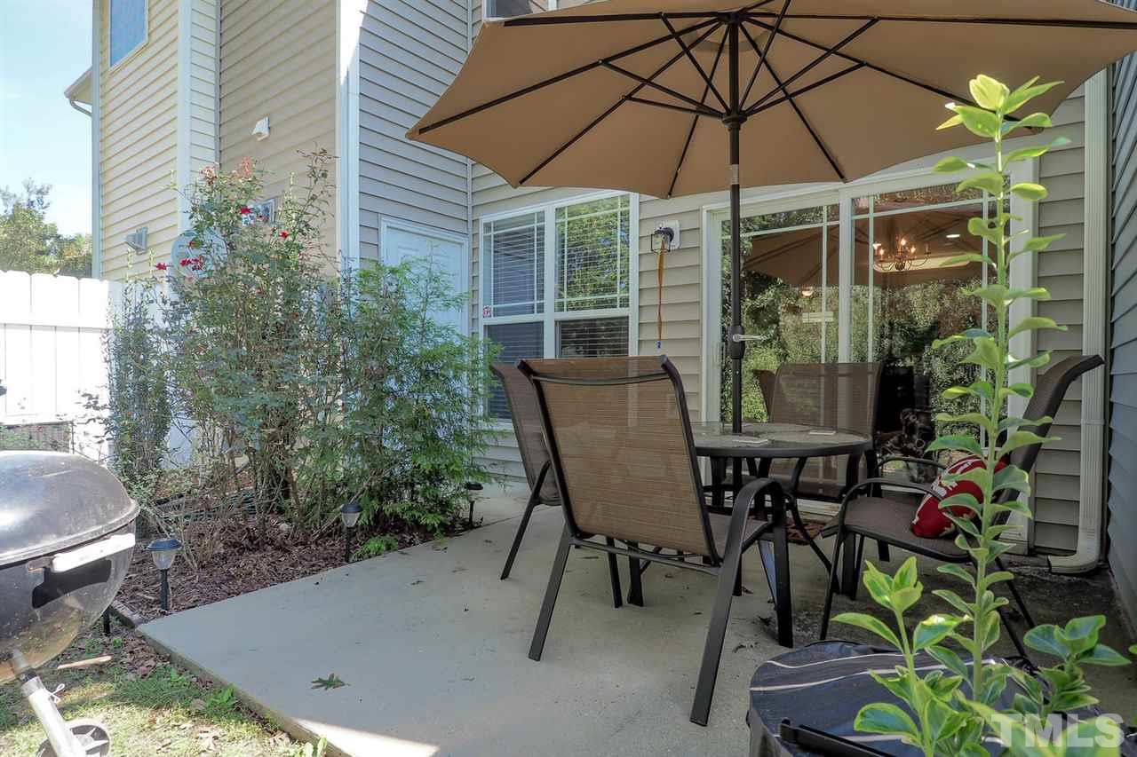 2112 Stoney Spring Drive Raleigh, NC 27610 - Photo 25 of 25 a view of a chair and table in backyard of the house