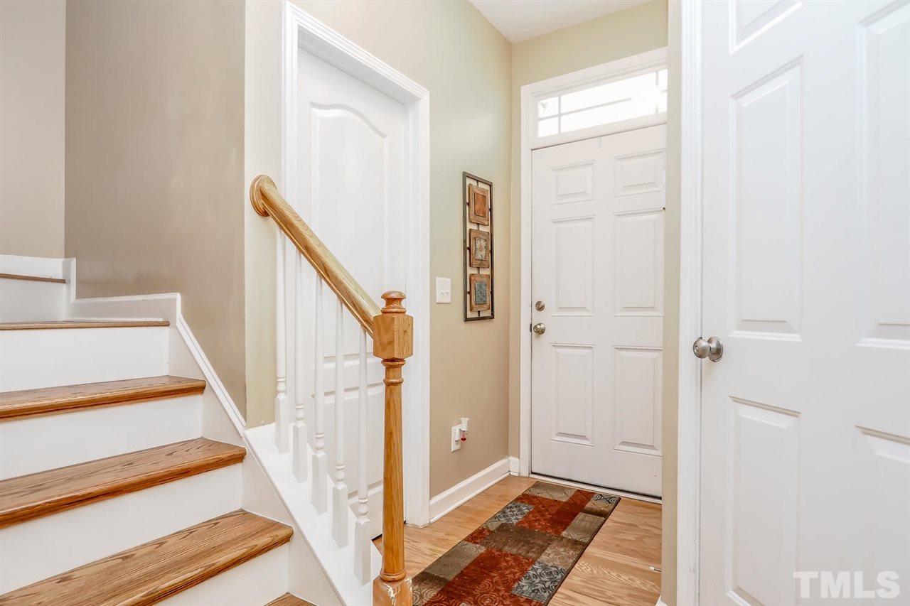 2112 Stoney Spring Drive Raleigh, NC 27610 - Photo 4 of 25 a view of a hallway with wooden floor and entryway