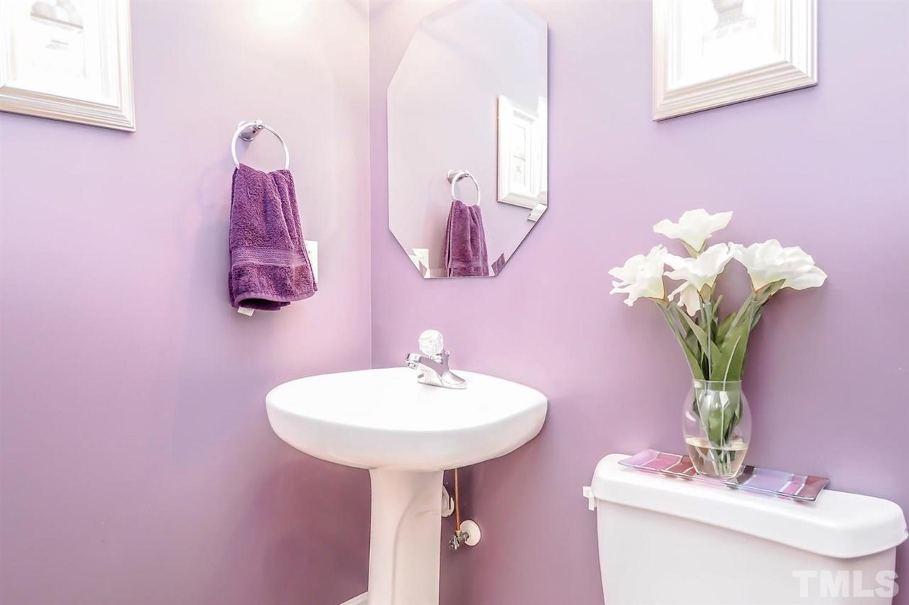2112 Stoney Spring Drive Raleigh, NC 27610 - Photo 5 of 25 a bathroom with a sink mirror and vanity