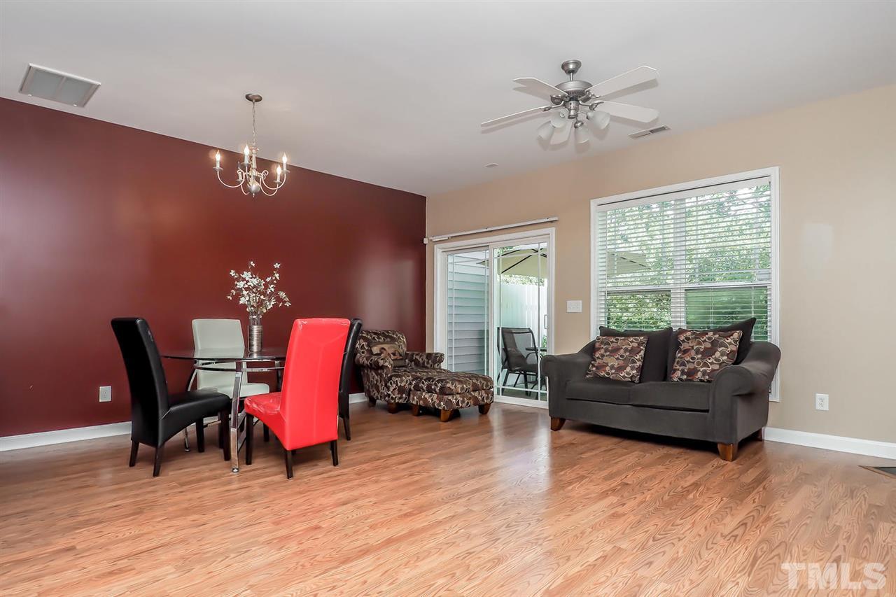 2112 Stoney Spring Drive Raleigh, NC 27610 - Photo 10 of 25 a living room with furniture and wooden floor