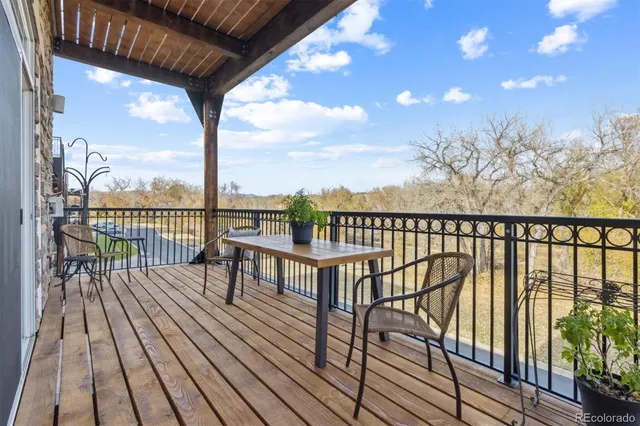 a view of a balcony with wooden floor