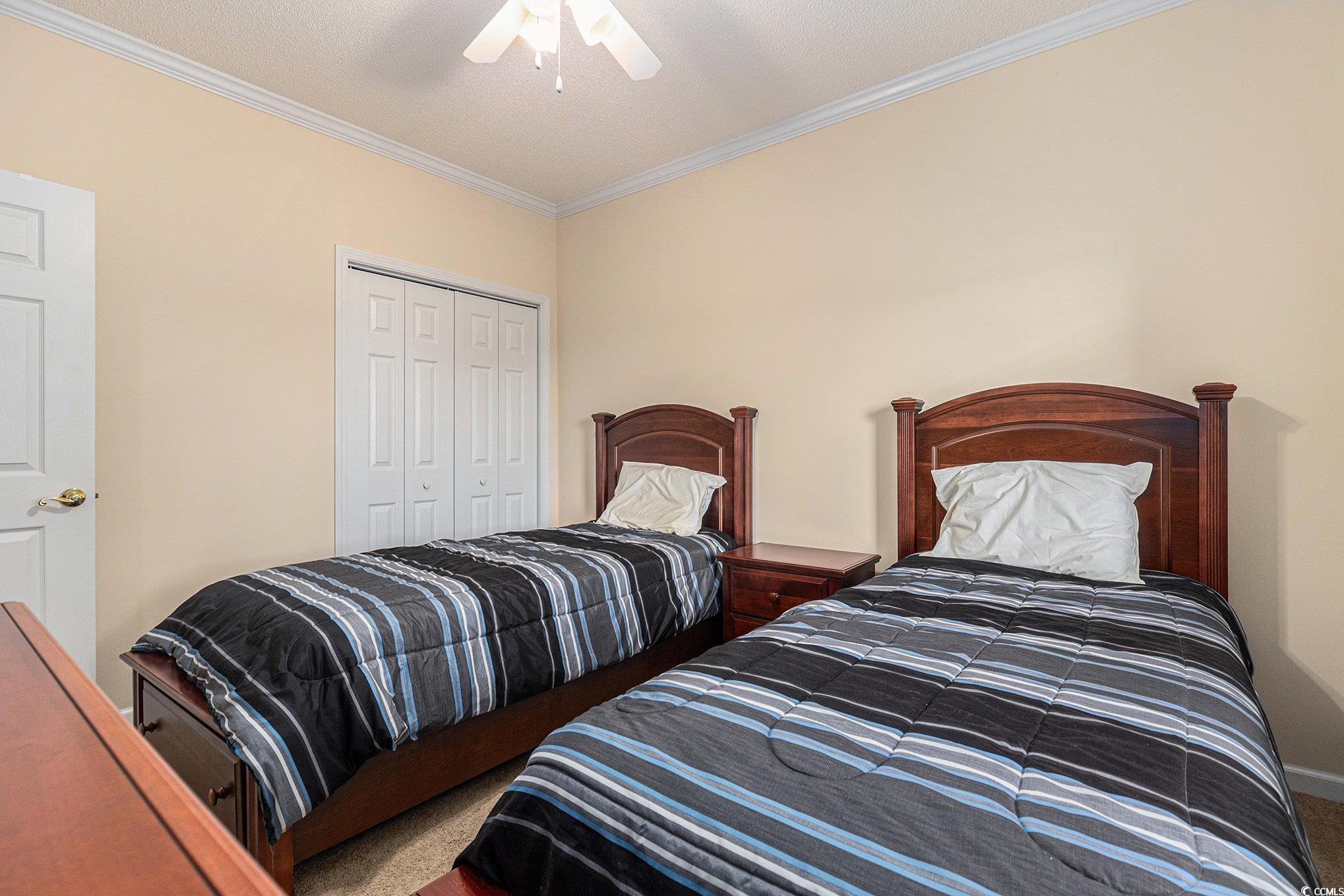 730 Charter Drive, Unit F11 Longs, SC 29568 - Photo 24 of 32 Bedroom featuring crown molding, light colored carpet, and ceiling fan