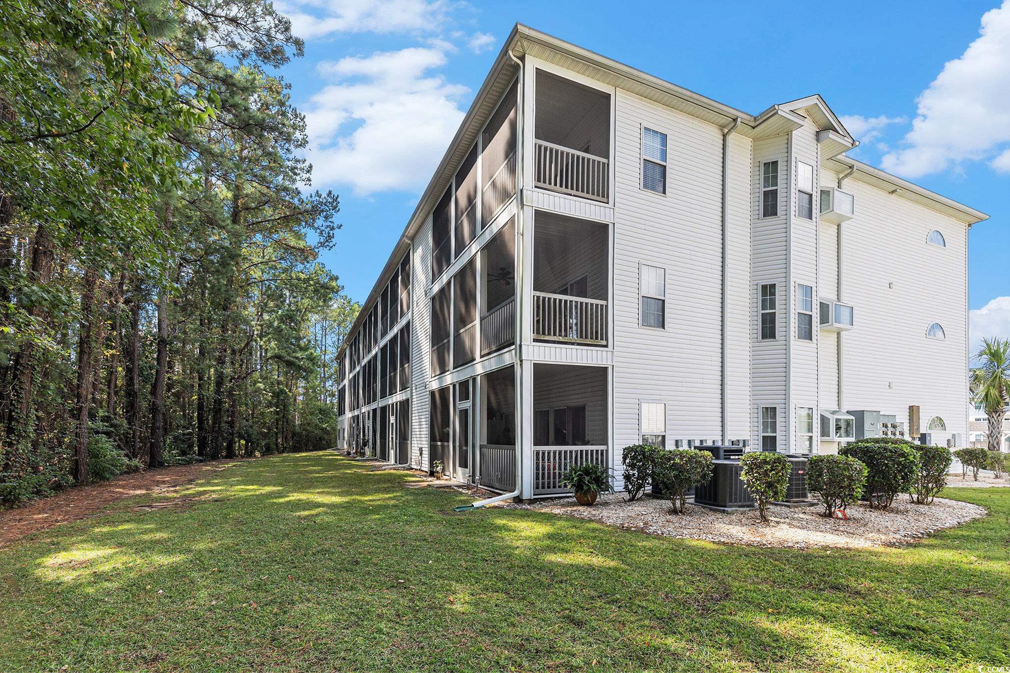 730 Charter Drive, Unit F11 Longs, SC 29568 - Photo 31 of 32 Community pool with a patio and a residential view