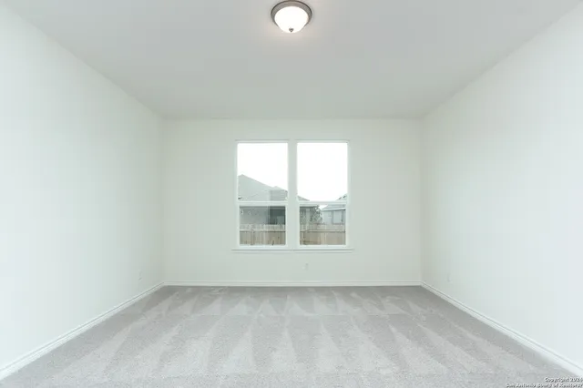 a spacious bathroom with a shower sink and mirror