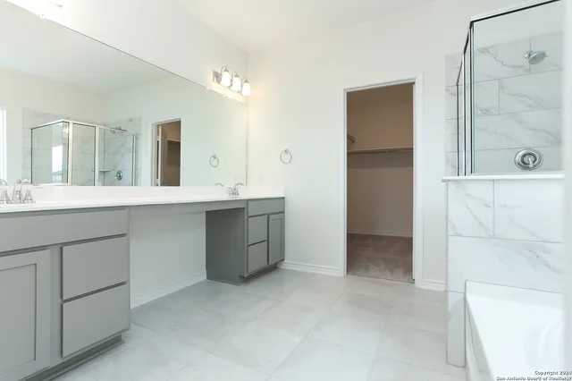 a bathroom with a bathtub and a shower