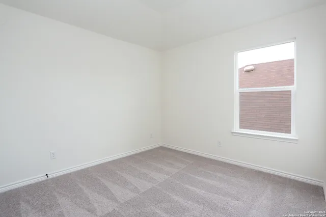 a front view of house with yard and outdoor seating