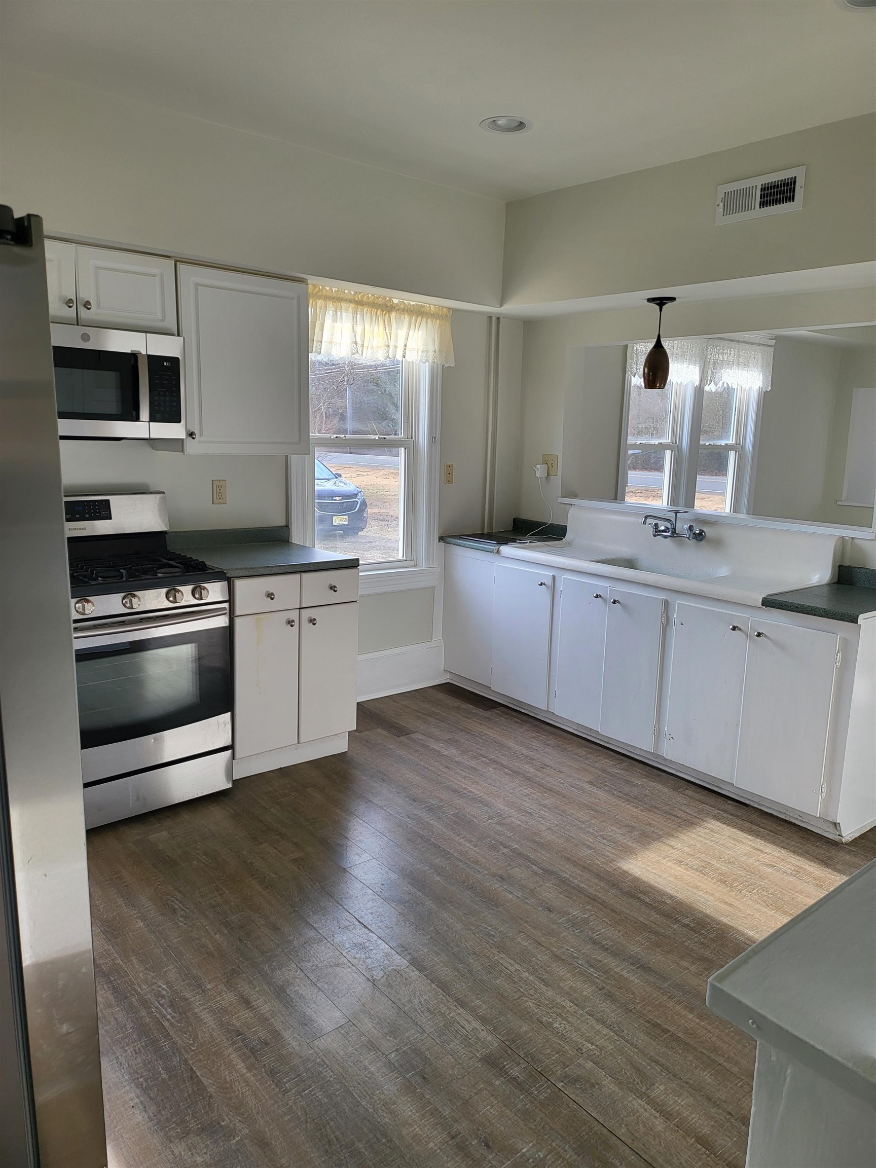 391 Highway 9 Erma, NJ 08204 - Photo 20 of 21 a kitchen with stainless steel appliances granite countertop a stove a sink and a refrigerator
