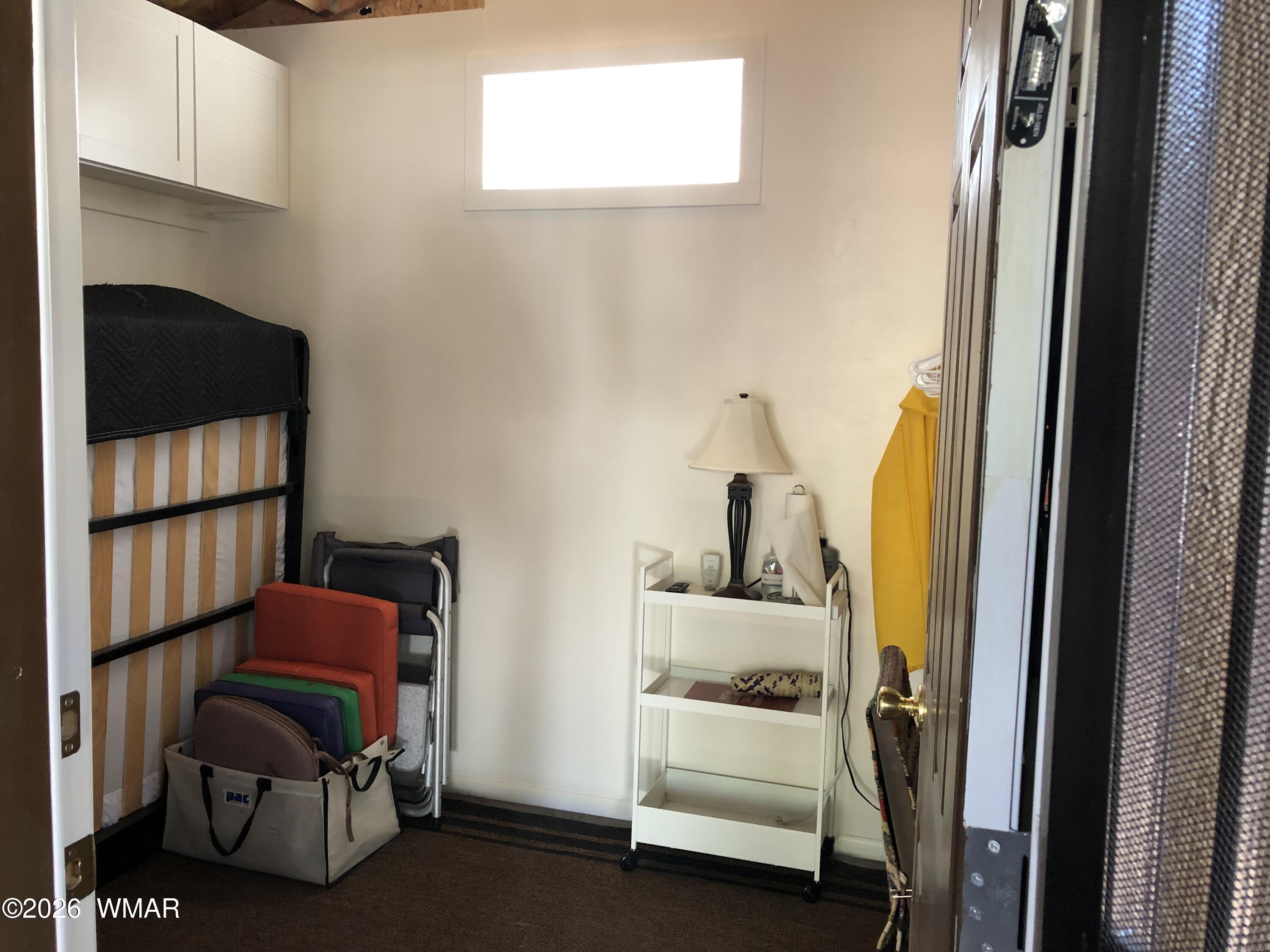 2301 Turtle Creek Road Show Low, AZ 85901 - Photo 26 of 35 a room with a chair and gym equipment