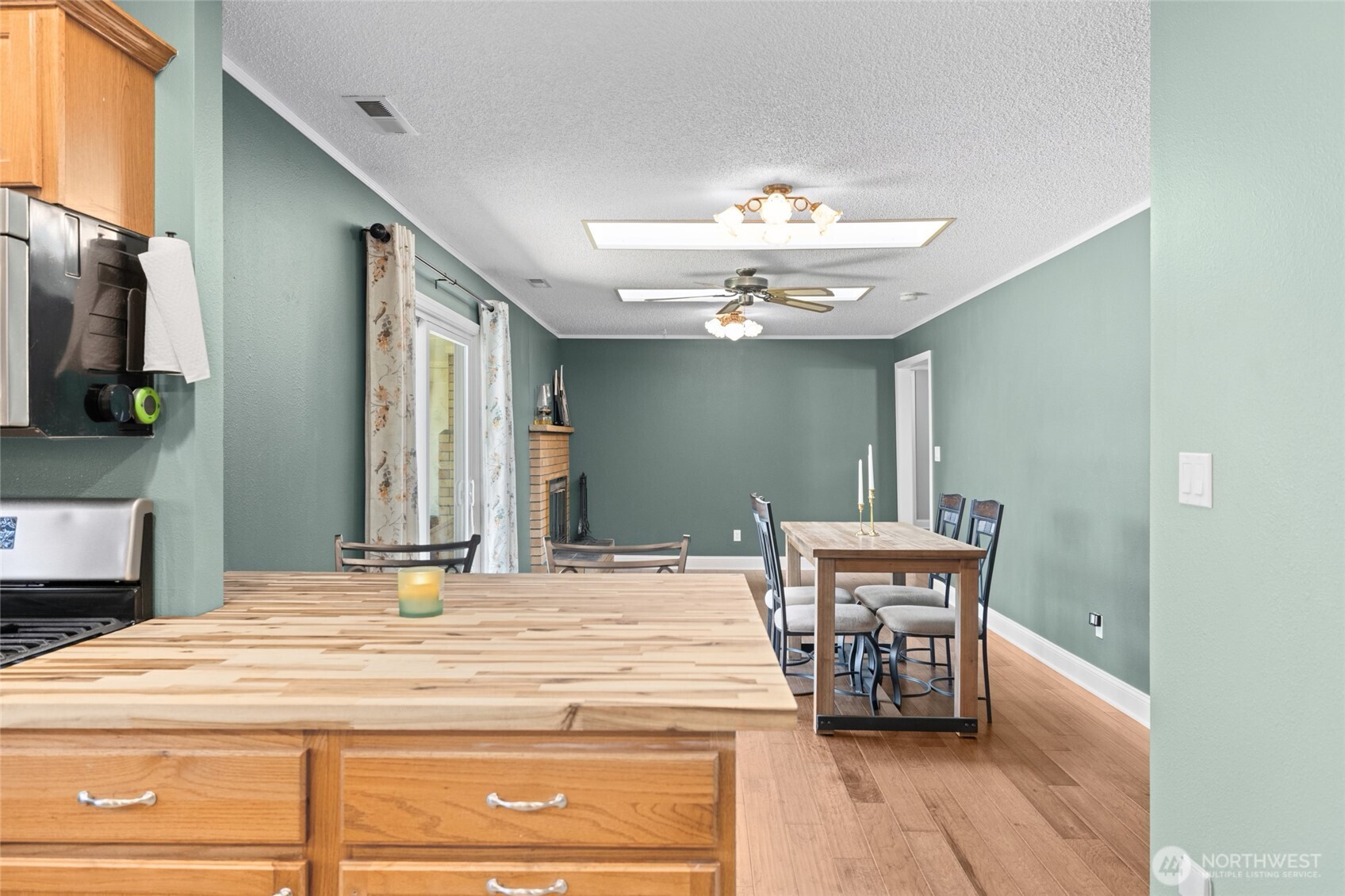 415 Sterling Street Sedro-Woolley, WA 98284 - Photo 20 of 38 a view of a dining room with furniture and chandelier