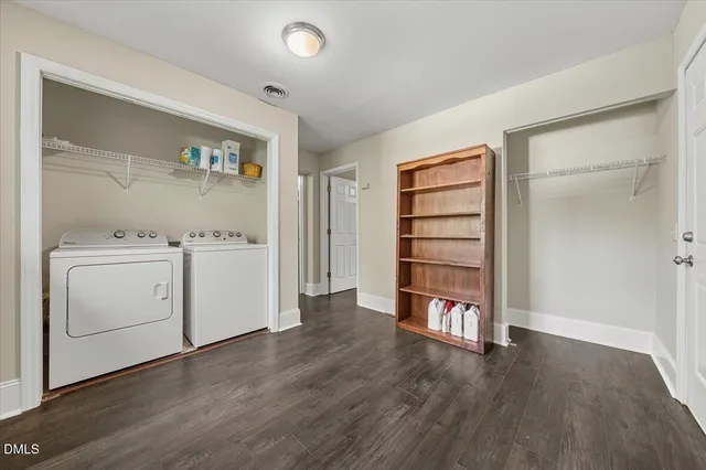 a view of an empty room with a closet