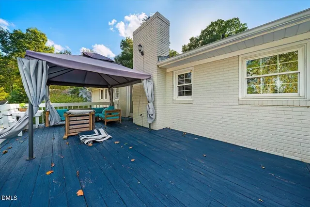 a view of a patio with wooden floor