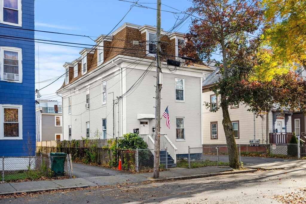 90 Timson Street Lynn, MA 01902 - Photo 1 of 38 a view of a white building among the street